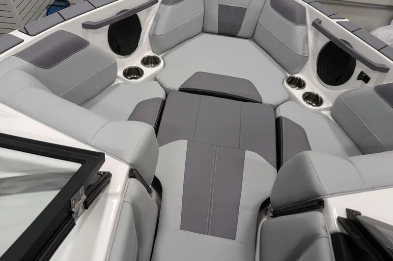 Slide: The Image of 2026 Malibu Wakesetter 20 VTX interior with gray seating and cup holders. - 19