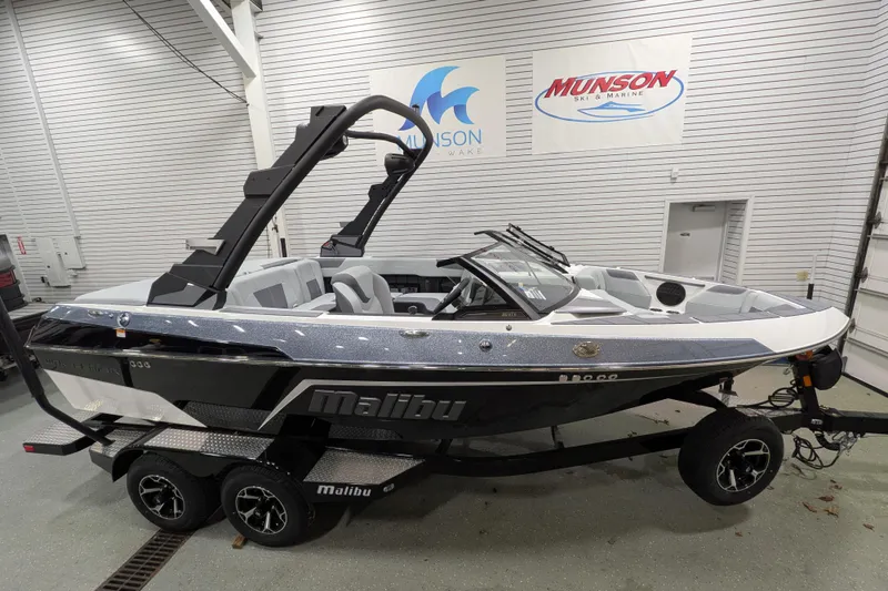 The Image of 2026 Malibu Wakesetter 20 VTX boat in showroom, featuring sleek design and modern features. - 2