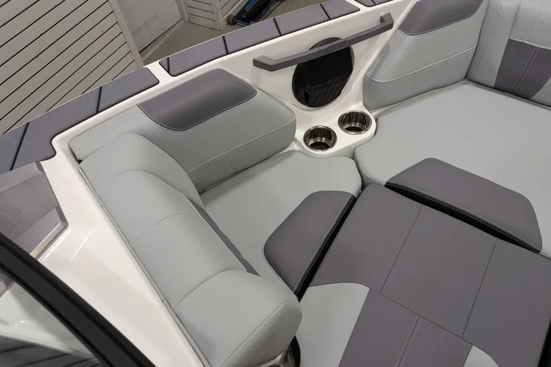 Slide: The Image of 2026 Malibu Wakesetter 20 VTX interior with gray seating and cup holders. - 20