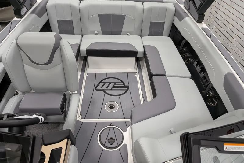 Slide: The Image of 2026 Malibu Wakesetter 20 VTX interior with sleek gray seating and modern design. - 22