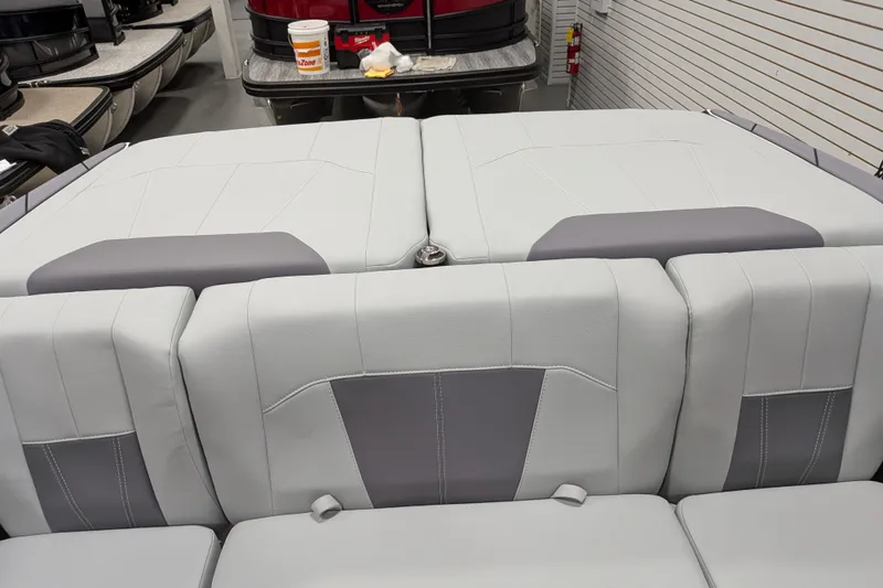 Slide: The Image of 2026 Malibu Wakesetter 20 VTX boat interior with gray and white seating. - 23