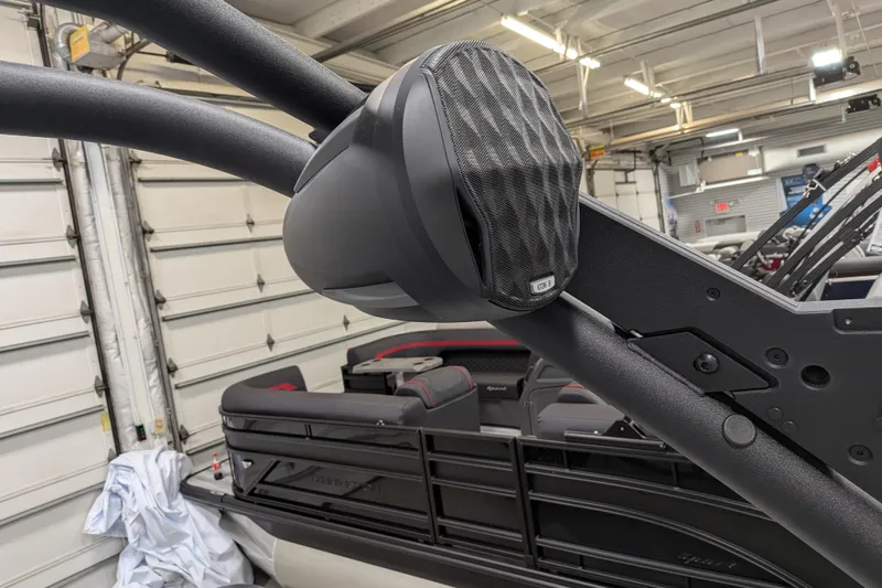 Slide: The Image of 2026 Malibu Wakesetter 20 VTX boat with mounted speaker in a garage setting. - 24