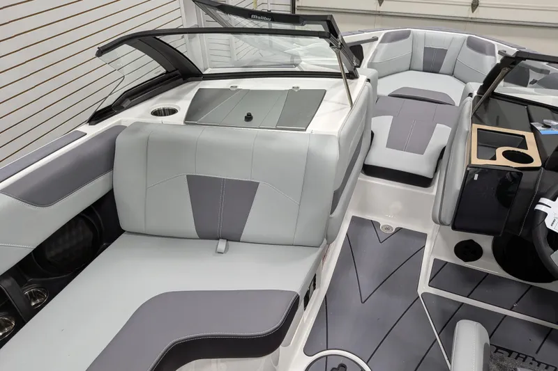 Slide: The Image of 2026 Malibu Wakesetter 20 VTX interior with sleek gray seating and modern design. - 26