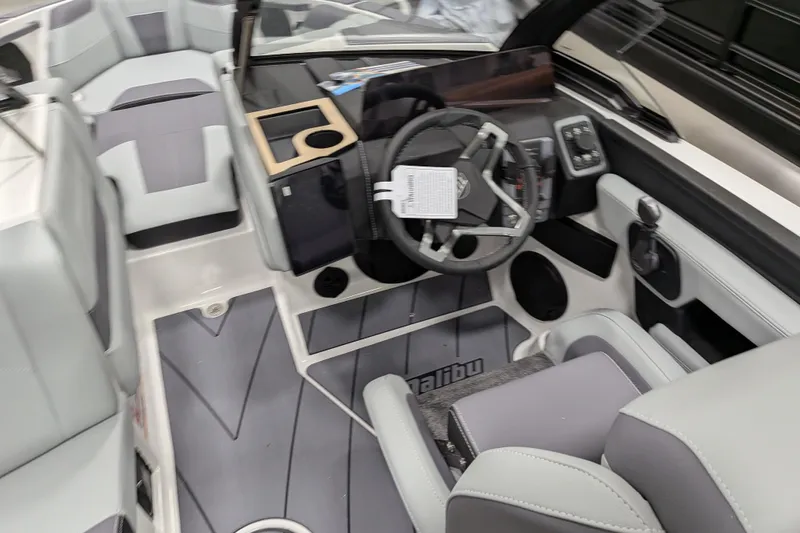 Slide: The Image of Interior of 2026 Malibu Wakesetter 20 VTX boat with modern steering and seating. - 27