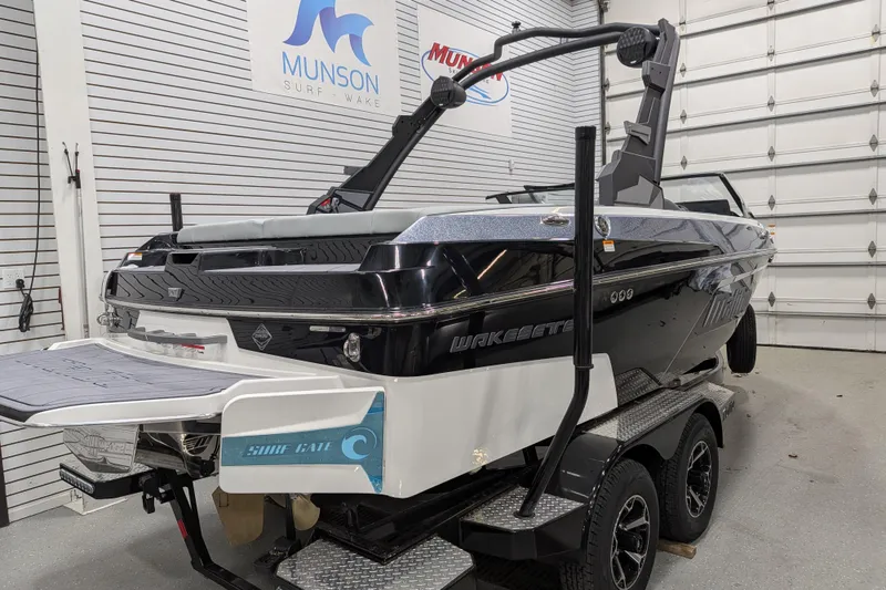 Slide: The Image of 2026 Malibu Wakesetter 20 VTX boat on trailer in showroom. - 5