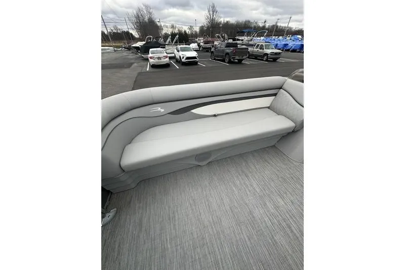 Slide: The Image of 2023 Bennington 21 SL pontoon boat interior with gray seating and flooring. - 10