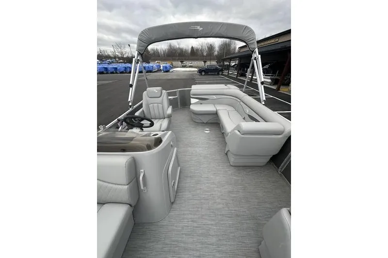 Slide: The Image of 2023 Bennington 21 SL pontoon boat with spacious seating and sleek design. - 14