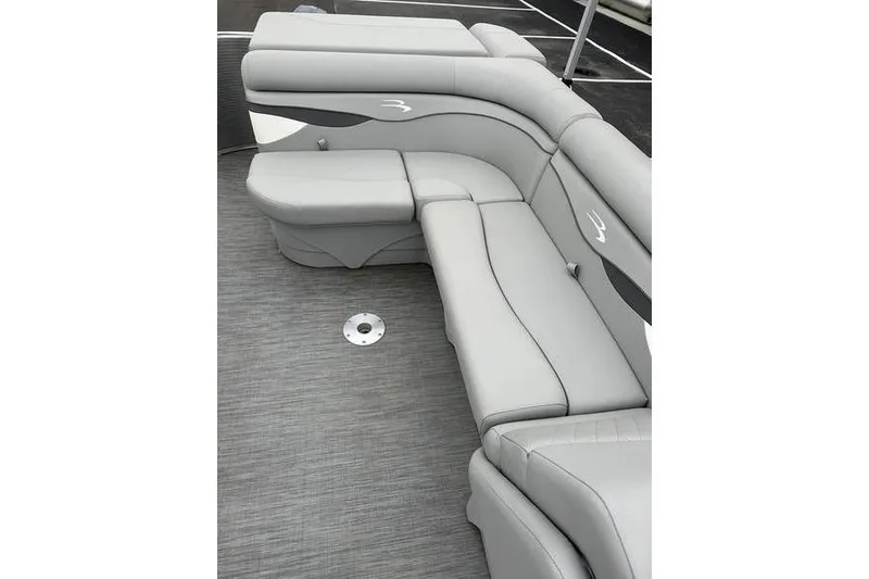 Slide: The Image of 2023 Bennington 21 SL boat with luxurious gray seating and sleek design. - 16