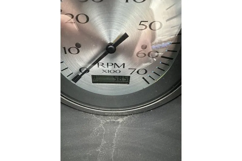 Slide: The Image of Close-up of a 2023 Bennington 21 SL RPM gauge displaying 575 RPM. - 4