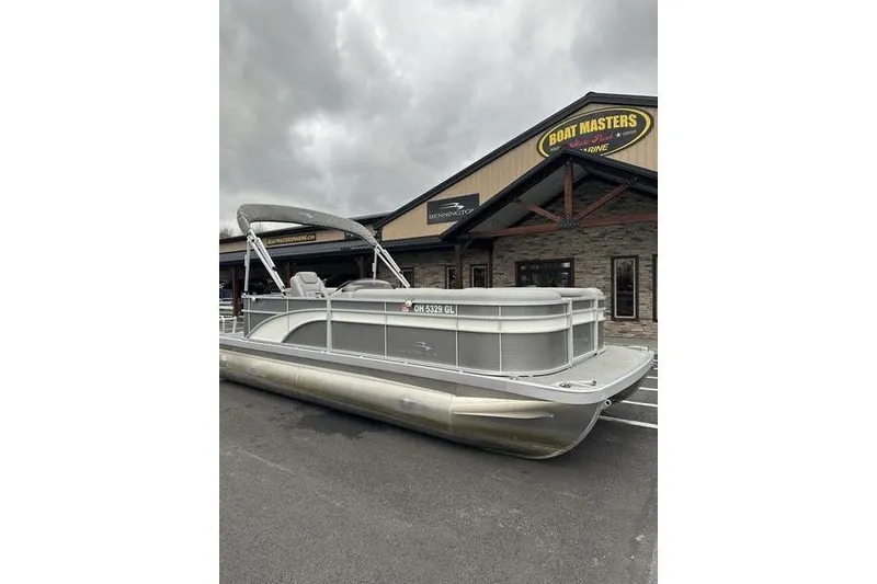 Slide: The Image of 2023 Bennington 21 SL pontoon boat parked outside Boat Masters Marine dealership. - 5
