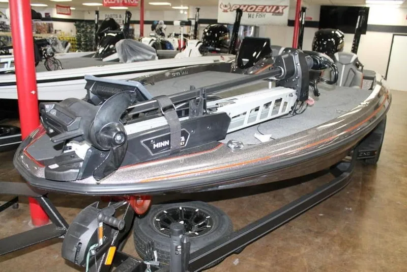 Slide: The Image of 2026 Skeeter ZXE21 boat with Minn Kota trolling motor in showroom. - 3