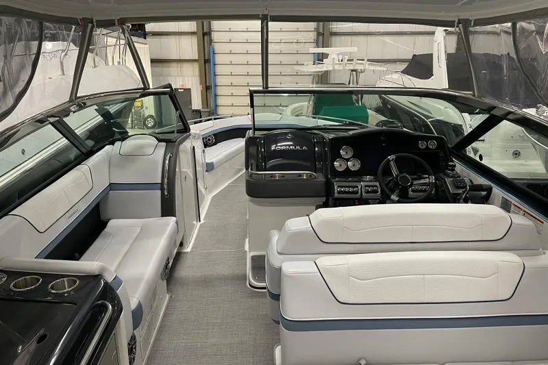 Slide: The Image of 2022 Formula 350 Crossover Bowrider interior with sleek design and modern dashboard. - 13