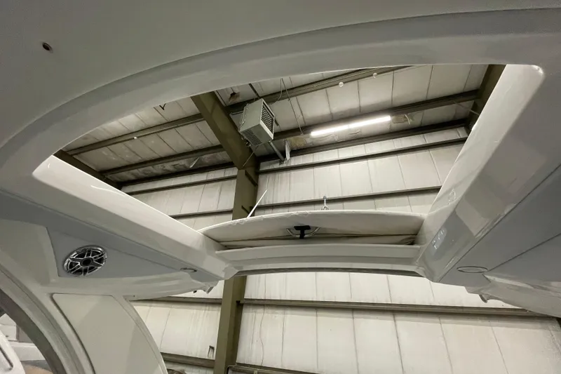 Slide: The Image of 2022 Formula 350 Crossover Bowrider interior view in a warehouse setting. - 14