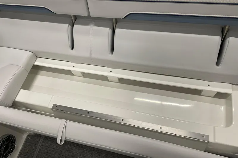 Slide: The Image of 2022 Formula 350 Crossover Bowrider storage compartment with sleek white interior design. - 19