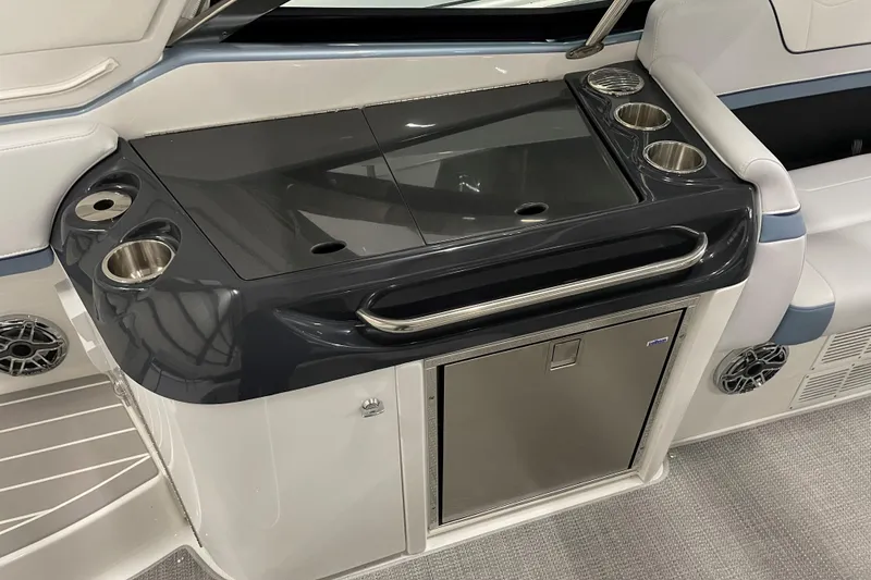 Slide: The Image of 2022 Formula 350 Crossover Bowrider interior with sleek kitchenette and cup holders. - 22