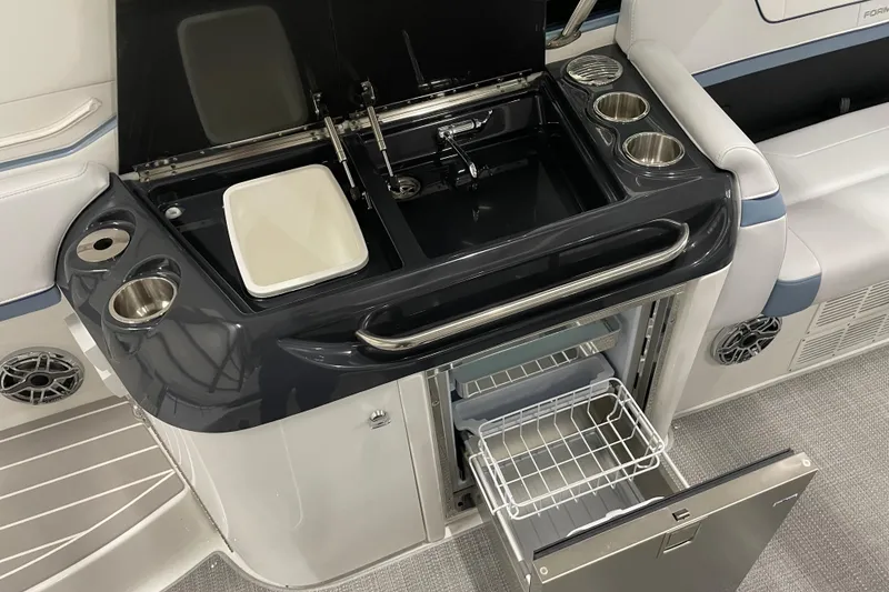 Slide: The Image of 2022 Formula 350 Crossover Bowrider with kitchenette, sink, and mini fridge. - 23