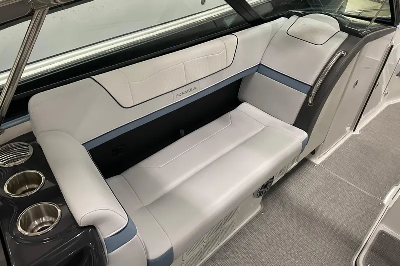 Slide: The Image of 2022 Formula 350 Crossover Bowrider interior with sleek seating and cup holders. - 24