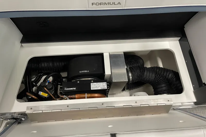 Slide: The Image of 2022 Formula 350 Crossover Bowrider engine compartment with Dometic components and ventilation system. - 25