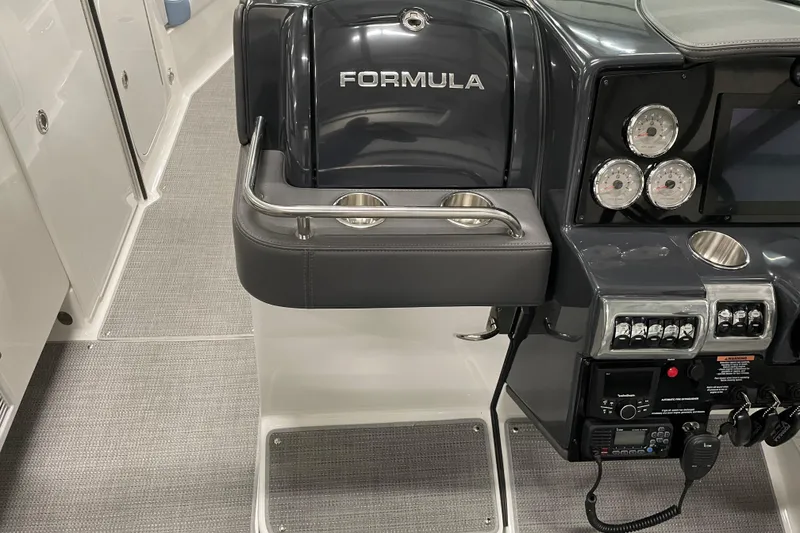 Slide: The Image of 2022 Formula 350 Crossover Bowrider dashboard with gauges and controls. - 28