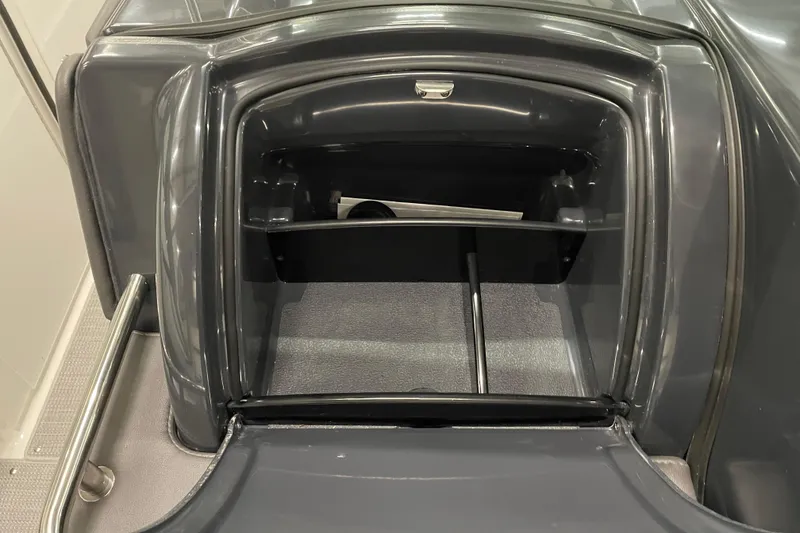 Slide: The Image of 2022 Formula 350 Crossover Bowrider storage compartment, sleek design, open hatch. - 29