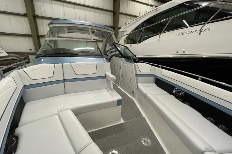 Slide: The Image of 2022 Formula 350 Crossover Bowrider interior with spacious seating in a showroom. - 44