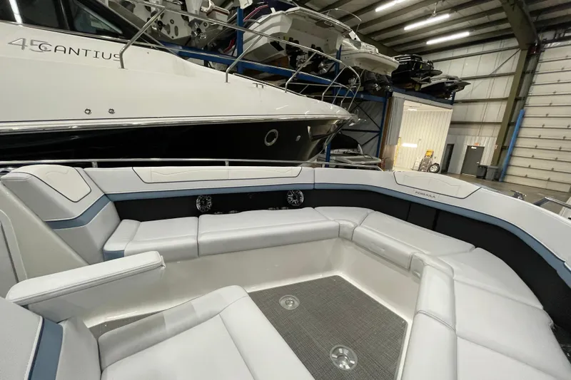 Slide: The Image of 2022 Formula 350 Crossover Bowrider interior with spacious seating in a showroom. - 45