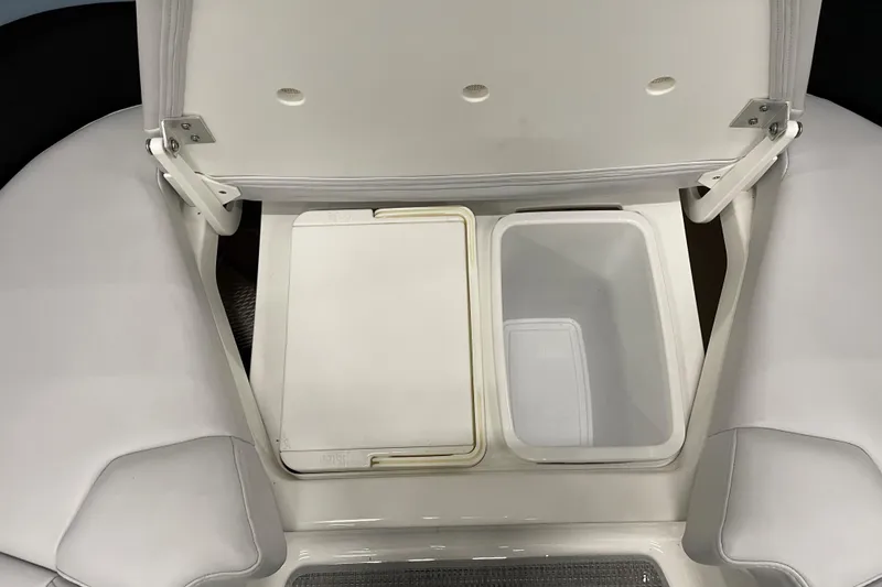 Slide: The Image of 2022 Formula 350 Crossover Bowrider storage compartment with open lid, showcasing interior space. - 46
