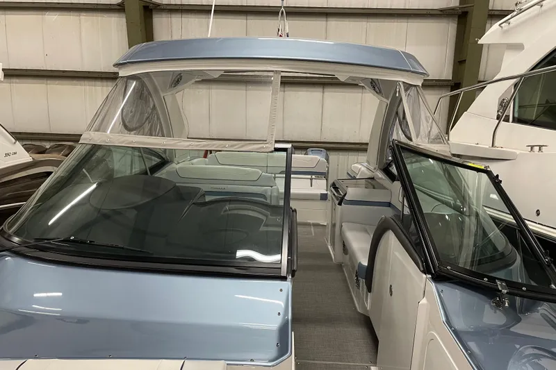 Slide: The Image of 2022 Formula 350 Crossover Bowrider in showroom, featuring sleek design and spacious interior. - 50