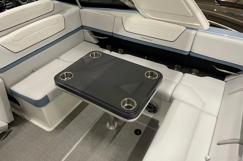 Slide: The Image of 2022 Formula 350 Crossover Bowrider interior with sleek seating and modern table design. - 53