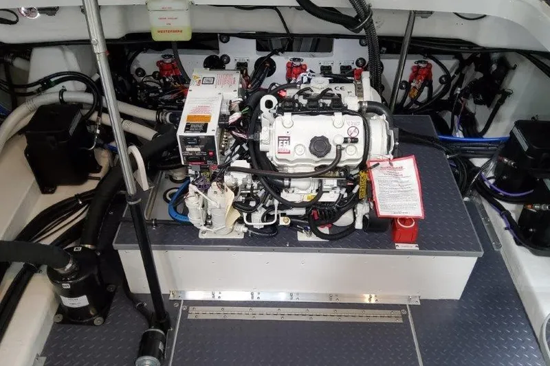 Slide: The Image of Engine compartment of a 2022 Formula 350 Crossover Bowrider, showcasing detailed wiring and components. - 64