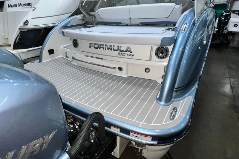 Slide: The Image of 2022 Formula 350 Crossover Bowrider boat with sleek design and spacious deck. - 8