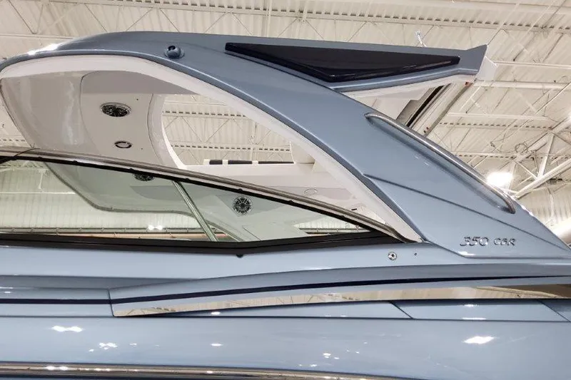 Slide: The Image of 2022 Formula 350 Crossover Bowrider, sleek design, indoor showroom display. - 9