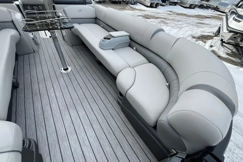 Slide: The Image of Luxurious interior of 2018 Avalon Excalibur Elite Windshield 27' boat with plush seating. - 10