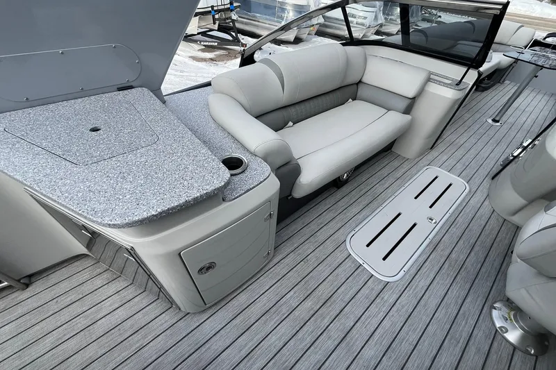 Slide: The Image of 2018 Avalon Excalibur Elite Windshield 27' boat interior with sleek seating and modern design. - 22