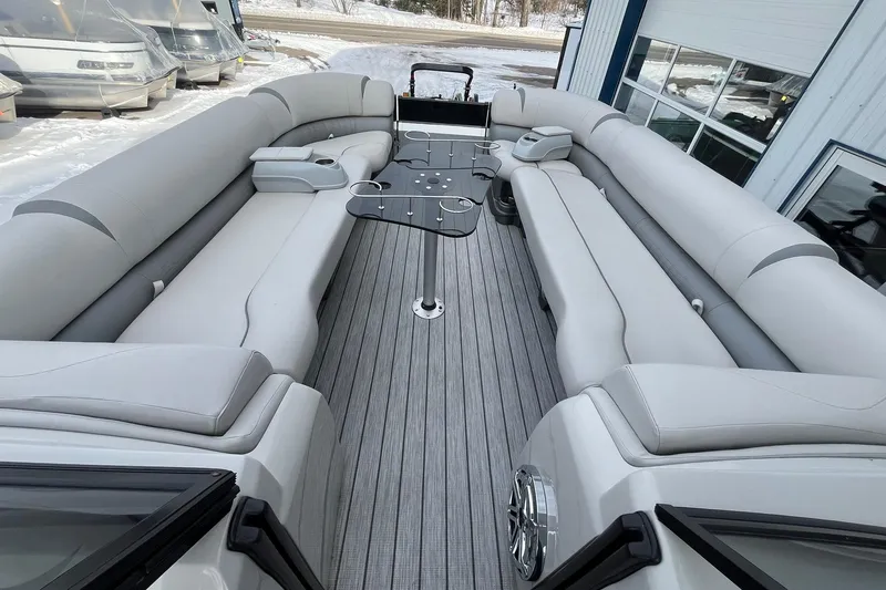 Slide: The Image of Luxurious 2018 Avalon Excalibur Elite Windshield boat interior with spacious seating and sleek design. - 27