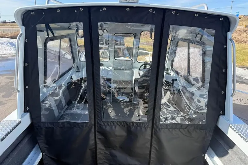 Slide: The Image of 2025 Hewescraft 200 ProV ET Hardtop interior view with protective cover. - 11