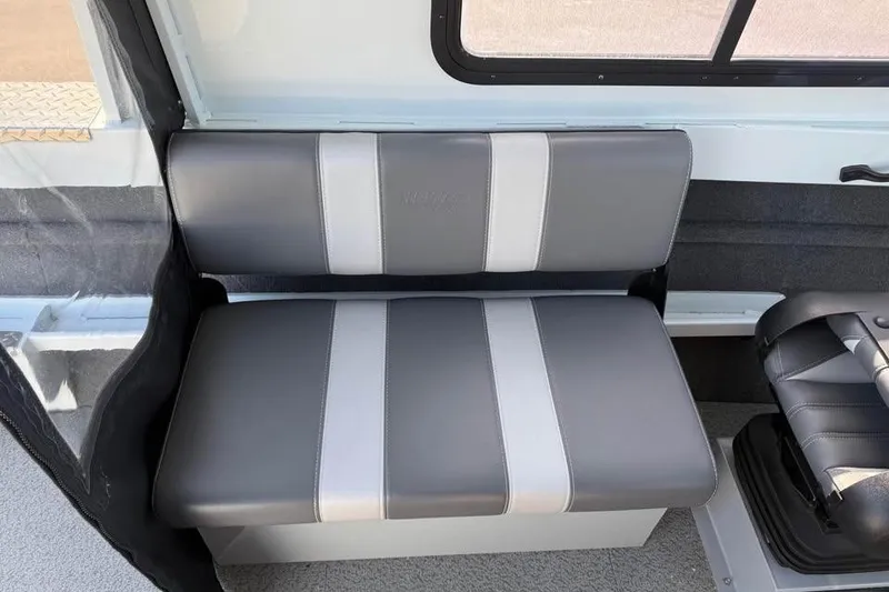 Slide: The Image of 2025 Hewescraft 200 ProV ET Hardtop interior seating, featuring gray and white cushioned bench. - 14