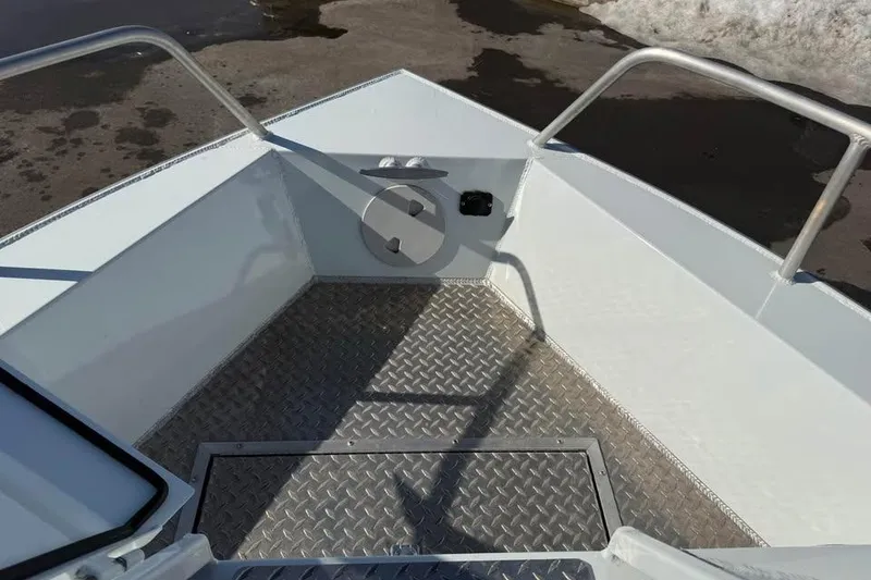 Slide: The Image of 2025 Hewescraft 200 ProV ET Hardtop boat deck with diamond plate flooring. - 18