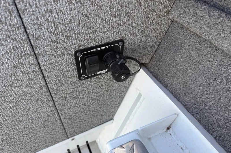 Slide: The Image of Water supply outlet on 2025 Hewescraft 200 ProV ET Hardtop boat interior. - 21