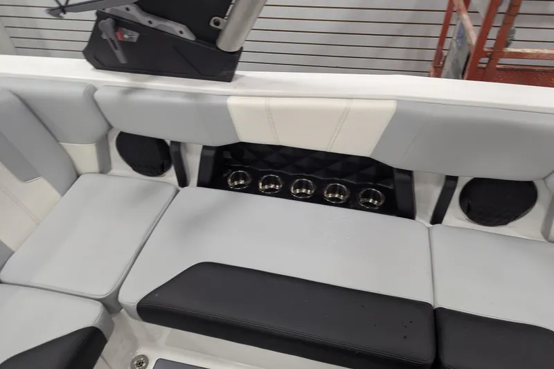 Slide: The Image of 2026 Malibu Wakesetter 21 LX interior seating with cup holders and modern design. - 11