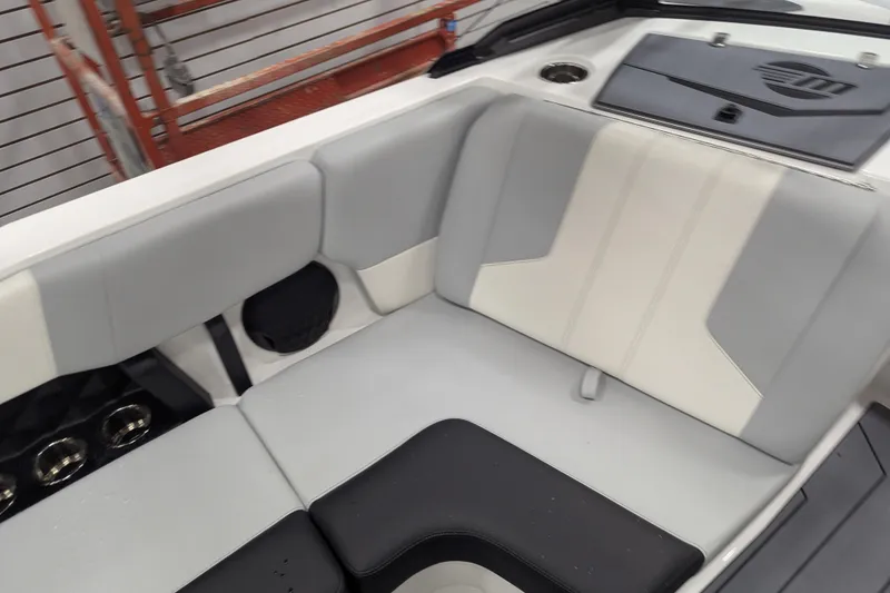 Slide: The Image of 2026 Malibu Wakesetter 21 LX interior with gray and white seating. - 12