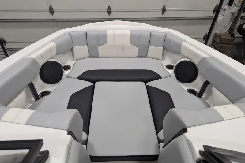 Slide: The Image of 2026 Malibu Wakesetter 21 LX interior with gray and black cushioned seating. - 14