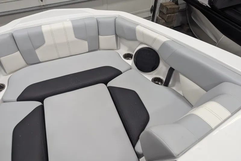 Slide: The Image of 2026 Malibu Wakesetter 21 LX interior with gray and white cushioned seating. - 15