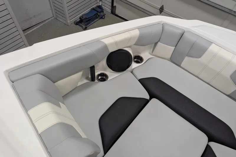 Slide: The Image of 2026 Malibu Wakesetter 21 LX interior seating with gray and white upholstery. - 16