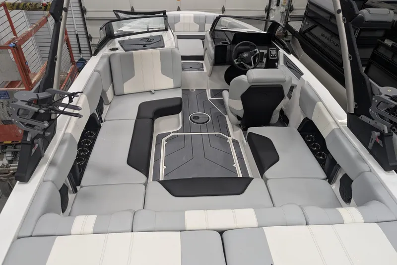 Slide: The Image of 2026 Malibu Wakesetter 21 LX interior with spacious seating and modern design. - 5