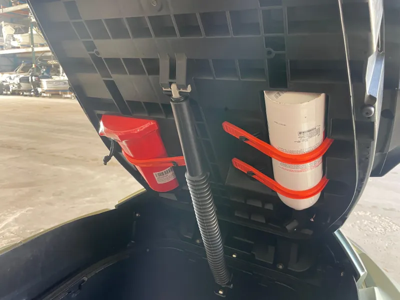 Slide: The Image of 2023 Sea-Doo GTX Limited 300 storage compartment with safety equipment. - 6