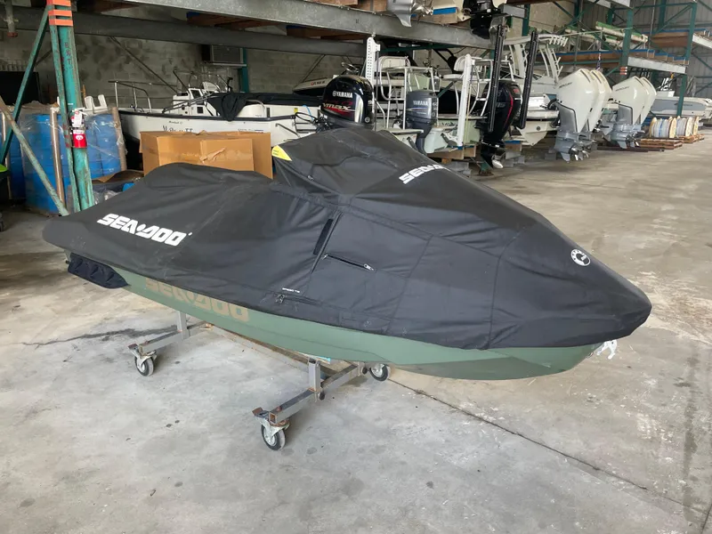 Slide: The Image of 2023 Sea-Doo GTX Limited 300 covered in storage, surrounded by boats and equipment. - 9