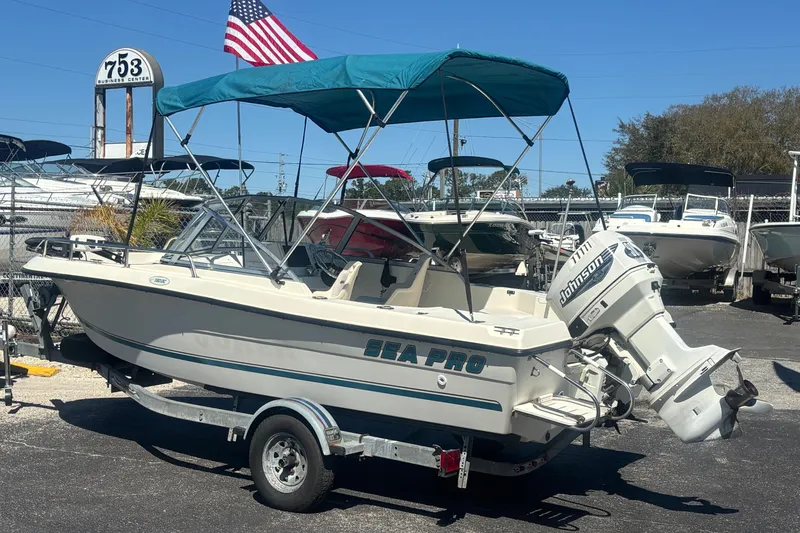Slide: The Image of 2000 Sea Pro 180 Dual Console boat with Johnson outboard motor on trailer. - 1