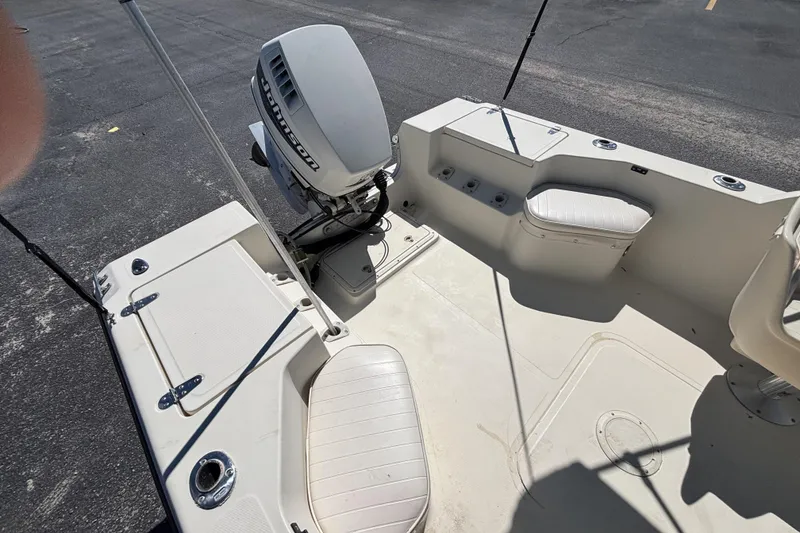 Slide: The Image of 2000 Sea Pro 180 Dual Console boat interior with Johnson outboard motor. - 16