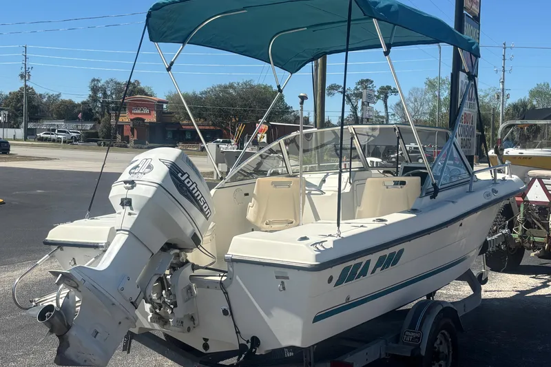Slide: The Image of 2000 Sea Pro 180 Dual Console boat with Johnson outboard motor on trailer. - 4